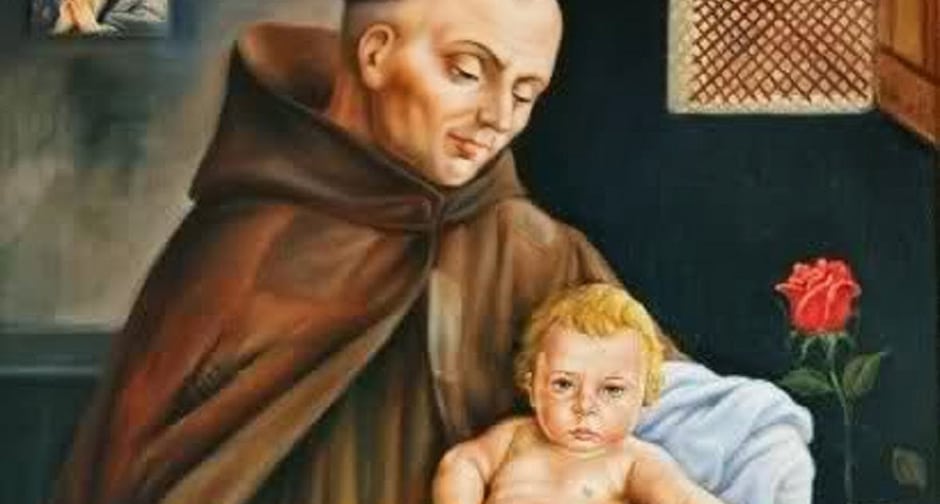 Imagem de São João José da Cruz segurando uma criança no colo