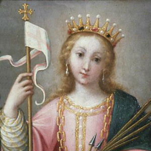 Imagem de Santa Úrsula com vestes de rainha e coroa na cabeça. Segura na mão direita um bastão com uma bandeira branca