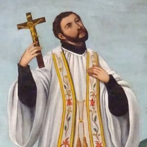 Imagem de São Francisco Xavier com vestes presbiterais brancas e uma estola dourada e segurando um crucifixo