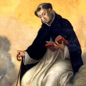 Imagem de Frei Gonçalo de Amarante sentado com uma bengala na mão direita e lendo uma bíblia na mão esquerda
